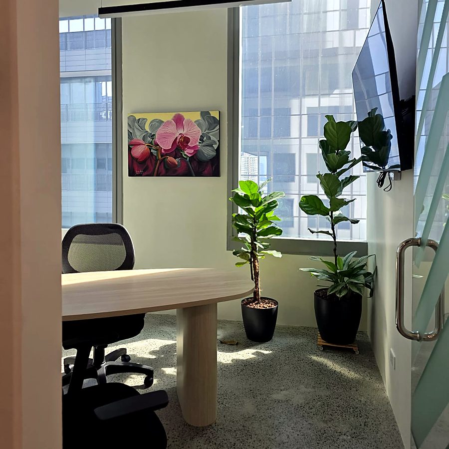 Small meeting room with plants and artwork